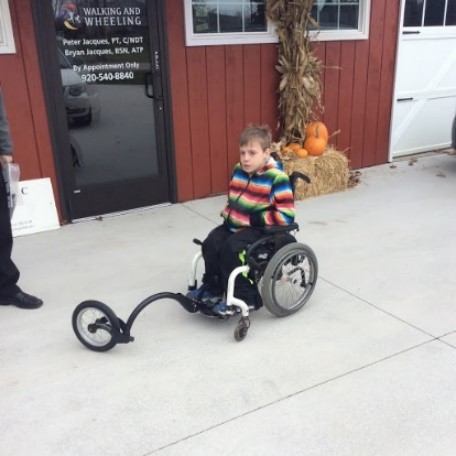 A “Free Wheel” add on to this young man's manual wheelchair.